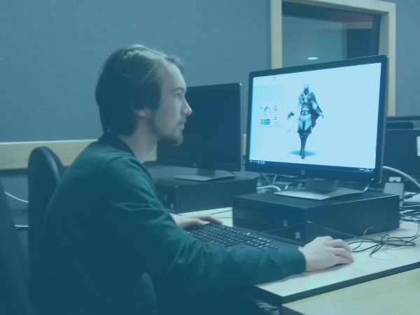 A student sitting at a computer taking part in a Game-athon